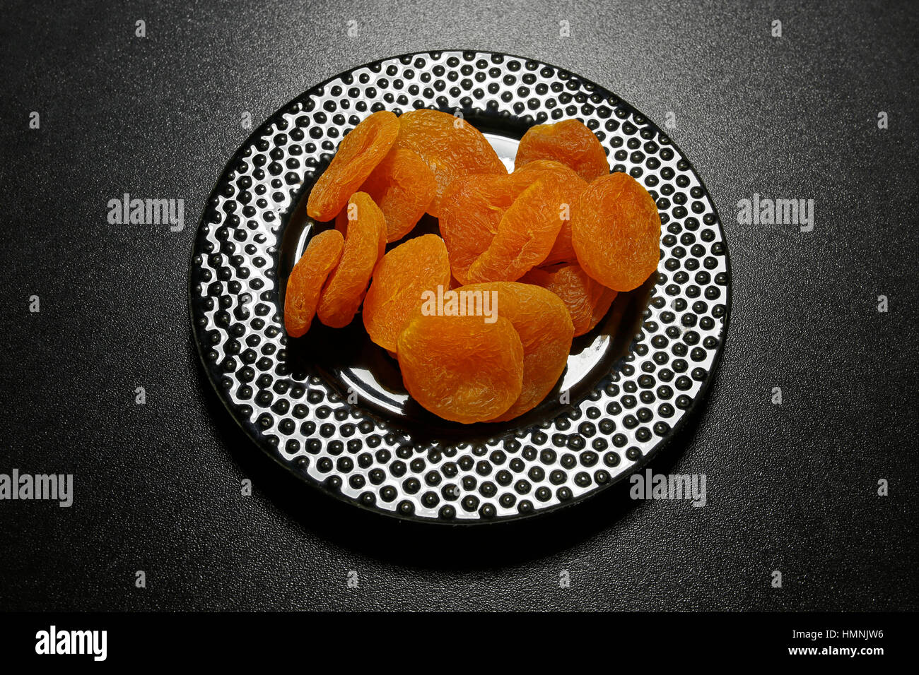 dried apricots on black shiny background Stock Photo Alamy