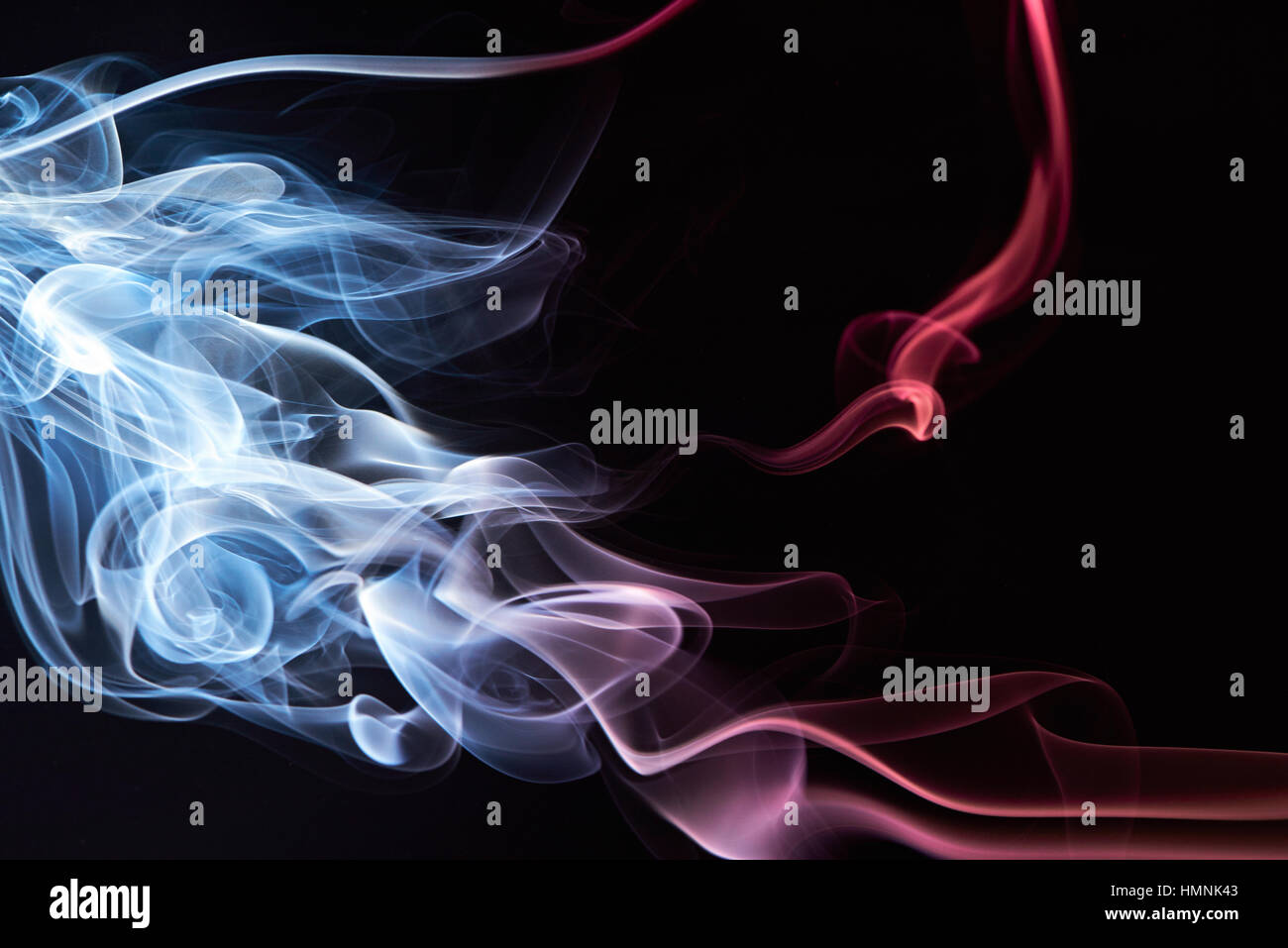 colorful smooth smoke as frame isolated on black Stock Photo