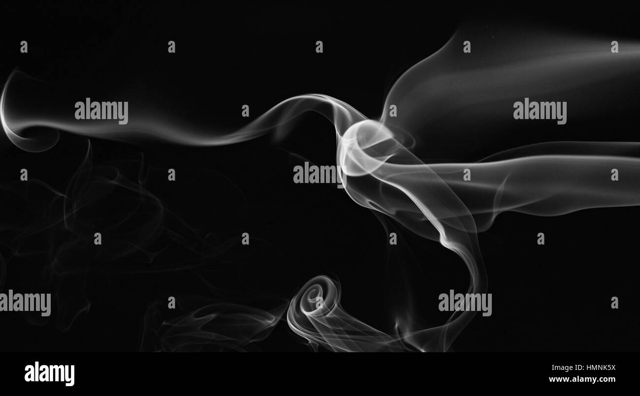 abstract gray smoke swirls isolated on black Stock Photo