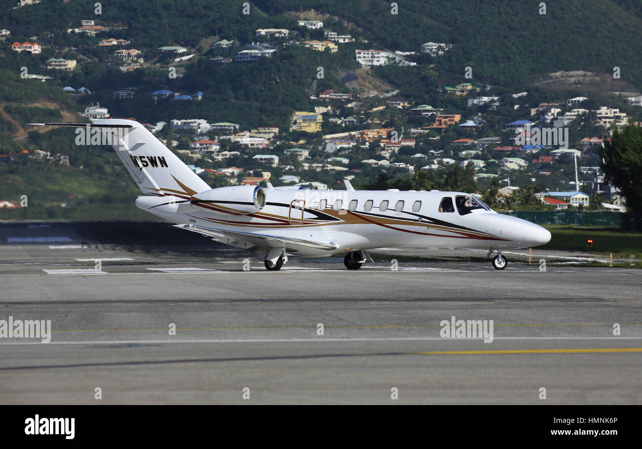 A Private Cessna Citation Jet prepares for take-off from Princess Juliana International Airport in Sint Maarten Stock Photo