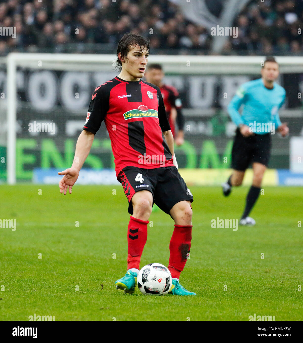 sports, football, Bundesliga, 2016/2017, Borussia Moenchengladbach versus SC Freiburg 3:0, Stadium Borussia Park, scene of the match, Caglar Soeyuencue (Freiburg) in ball possession Stock Photo