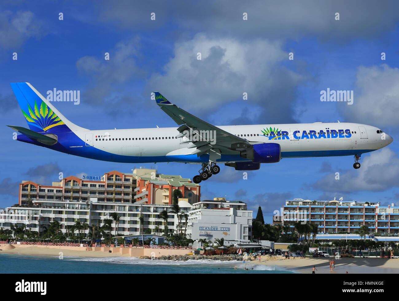 Air Caraibes Airbus A.330 landing over Maho Beach, Sint Maarten Stock Photo