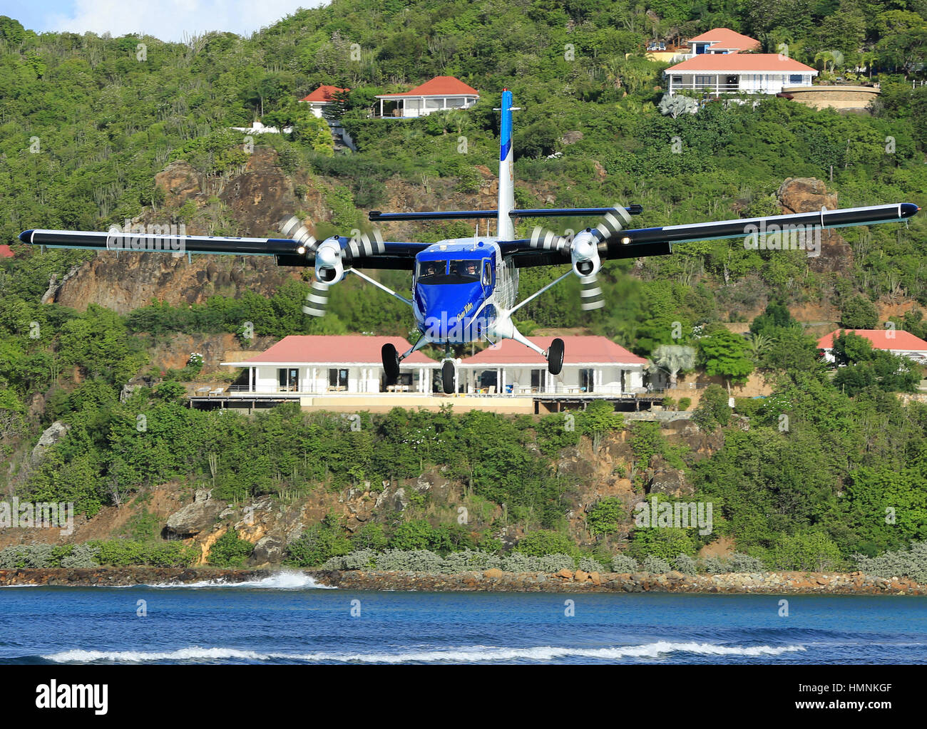 A Winair Twin Otter on short finals to Runway 28 at St. Barth's Stock Photo