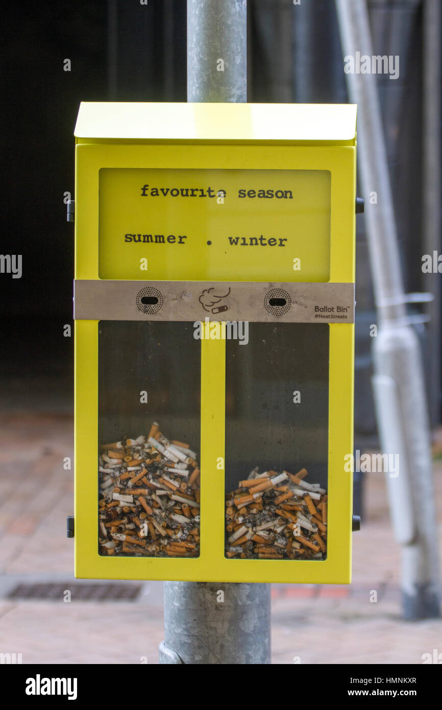 cigarette bins uk Yellow questions, public opinion, street ashtrays, fag ends voting, used  butts, cigarette bins to reduce cigarette littering in Blackpool, UK Stock  Photo