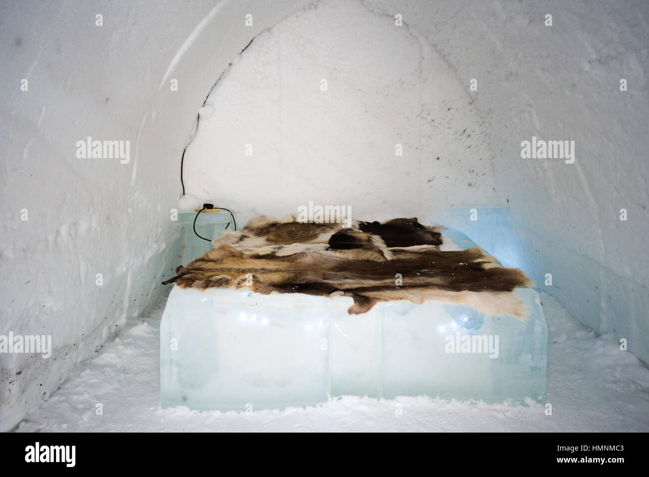 igloo interior with an ice bed and animal skin Stock Photo