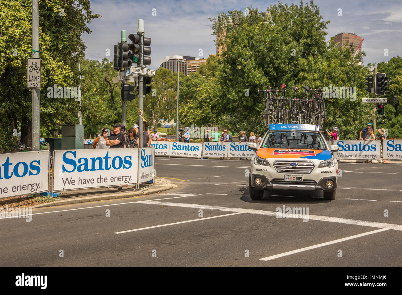 The Tour Down Under races around the street circuit of central Adelaide and is serviced by the professional team cars following the racers closely Stock Photo
