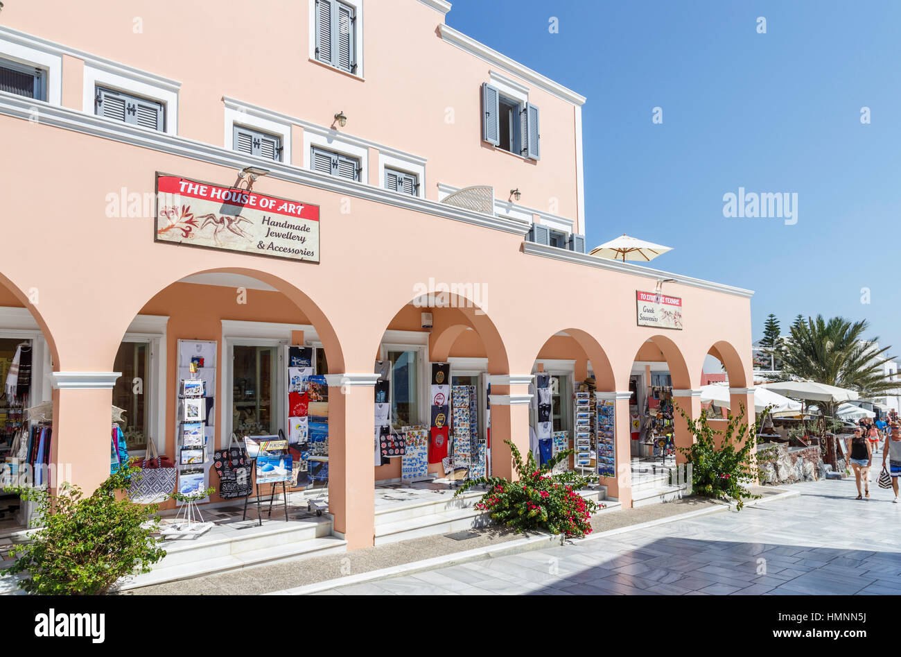 Typical souvenir shops in the main street of Oia, Santorini, a Mediterranean Greek Island in the Cyclades group Stock Photo