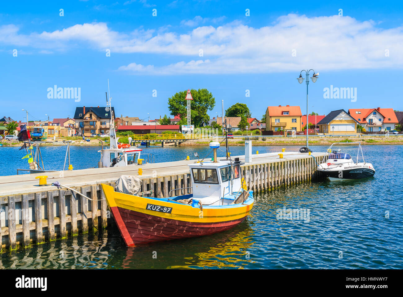 KUZNICA PORT, POLAND - JUN 22, 2016: Colorful fishing boats anchoring in Kuznica port on Hel peninsula, Baltic Sea, Poland. Stock Photo
