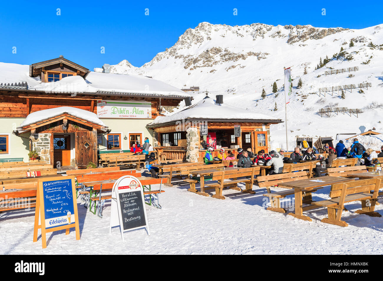 OBERTAUERN SKI RESORT, AUSTRIA - JAN 22, 2017: skiers dining in mountain hut in Obertauern ski area in Salzburg land, Austrian Alps. Stock Photo