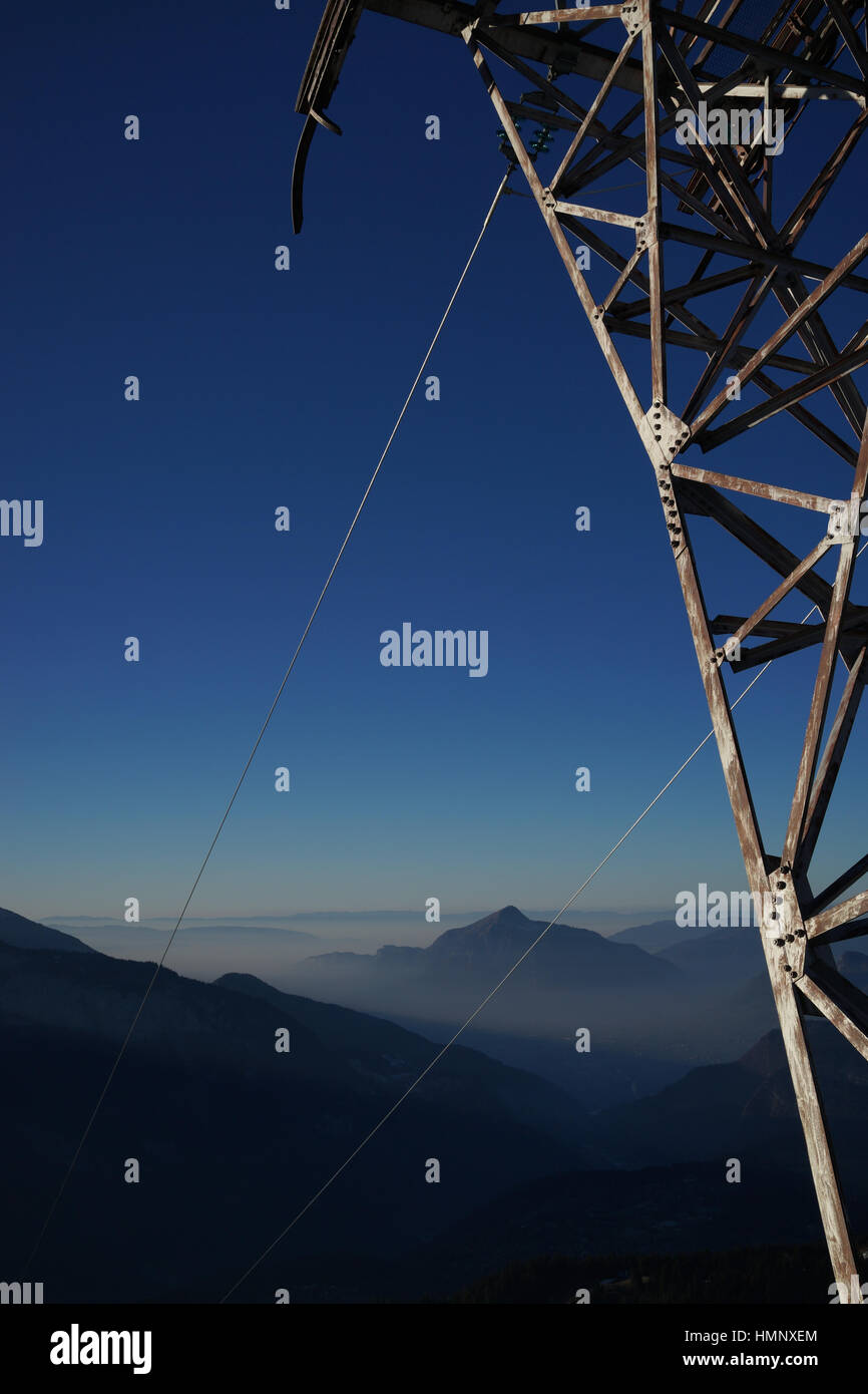 Electricity pylon in the French alps (seen from Flaine golf course) Stock Photo