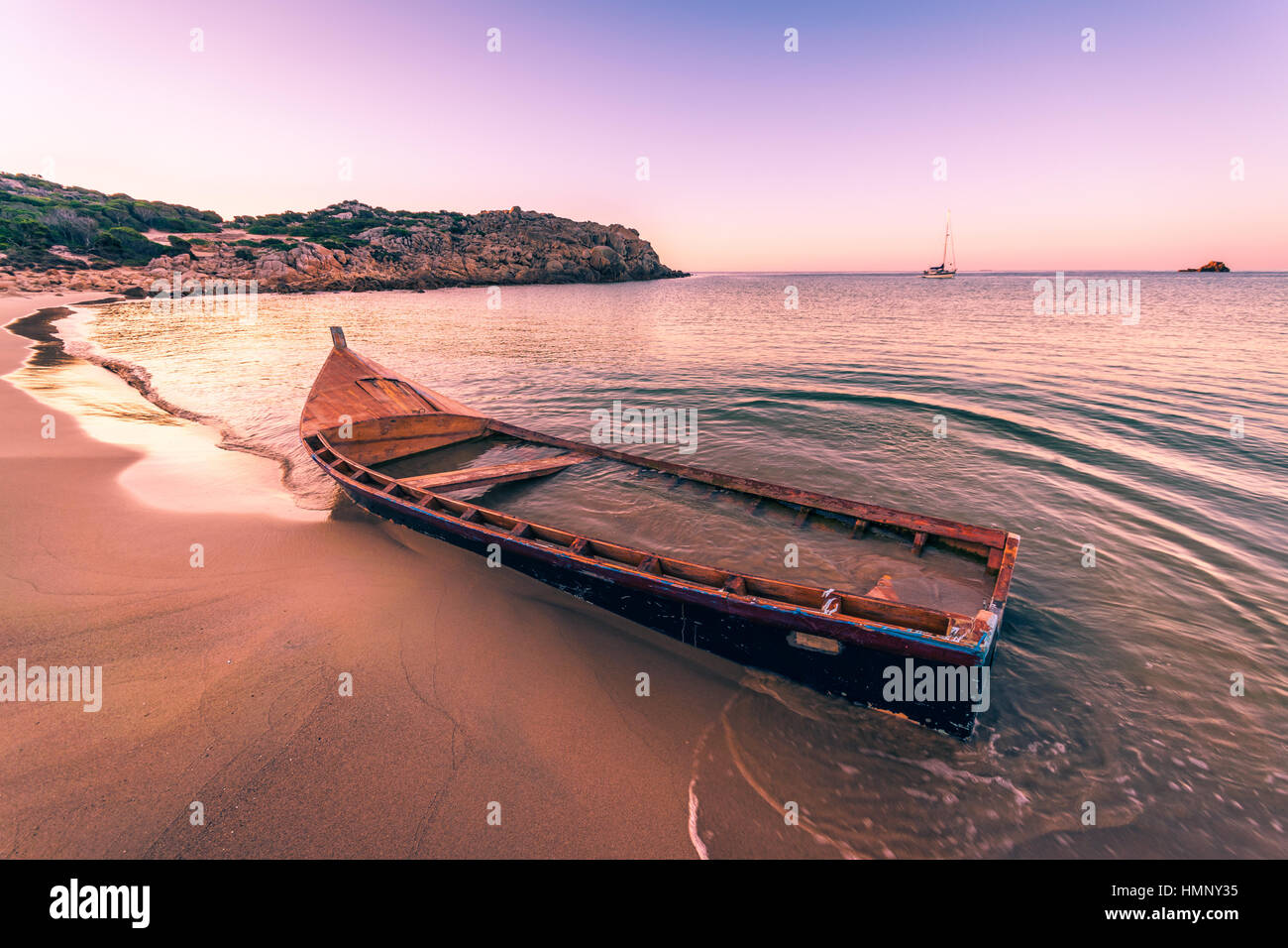 Old wooden boat wrecked on a sandy beach Stock Photo - Alamy