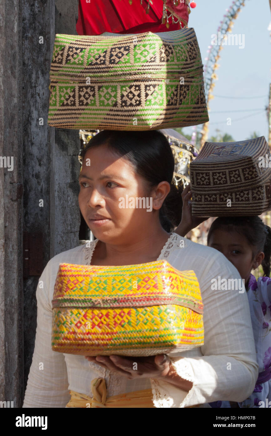 Woman carrying offerings to the temple during the Galungan festival in Bali, Indonesia Stock Photo