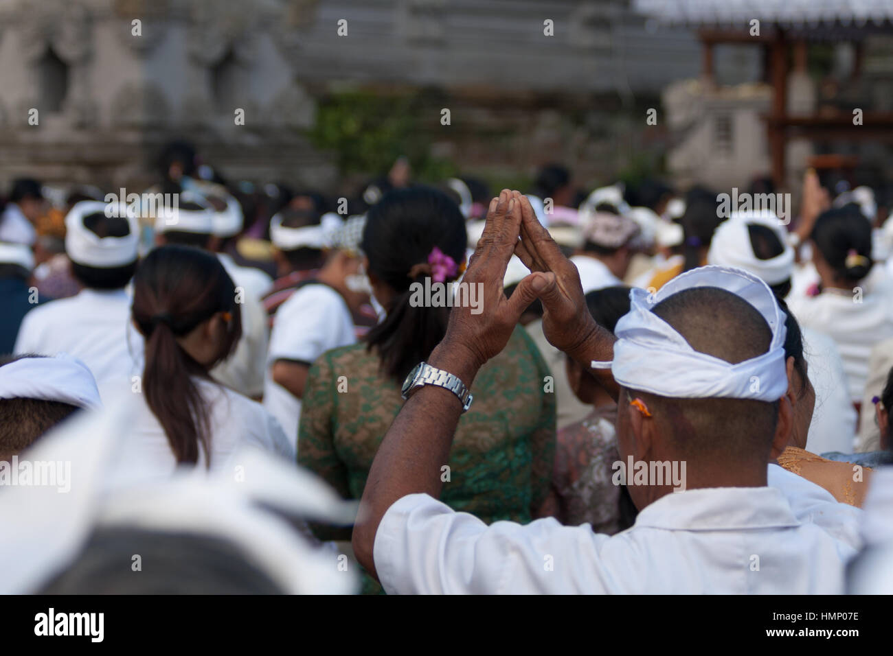 People praying in the temple during the Galungan festival in Bali, Indonesia Stock Photo