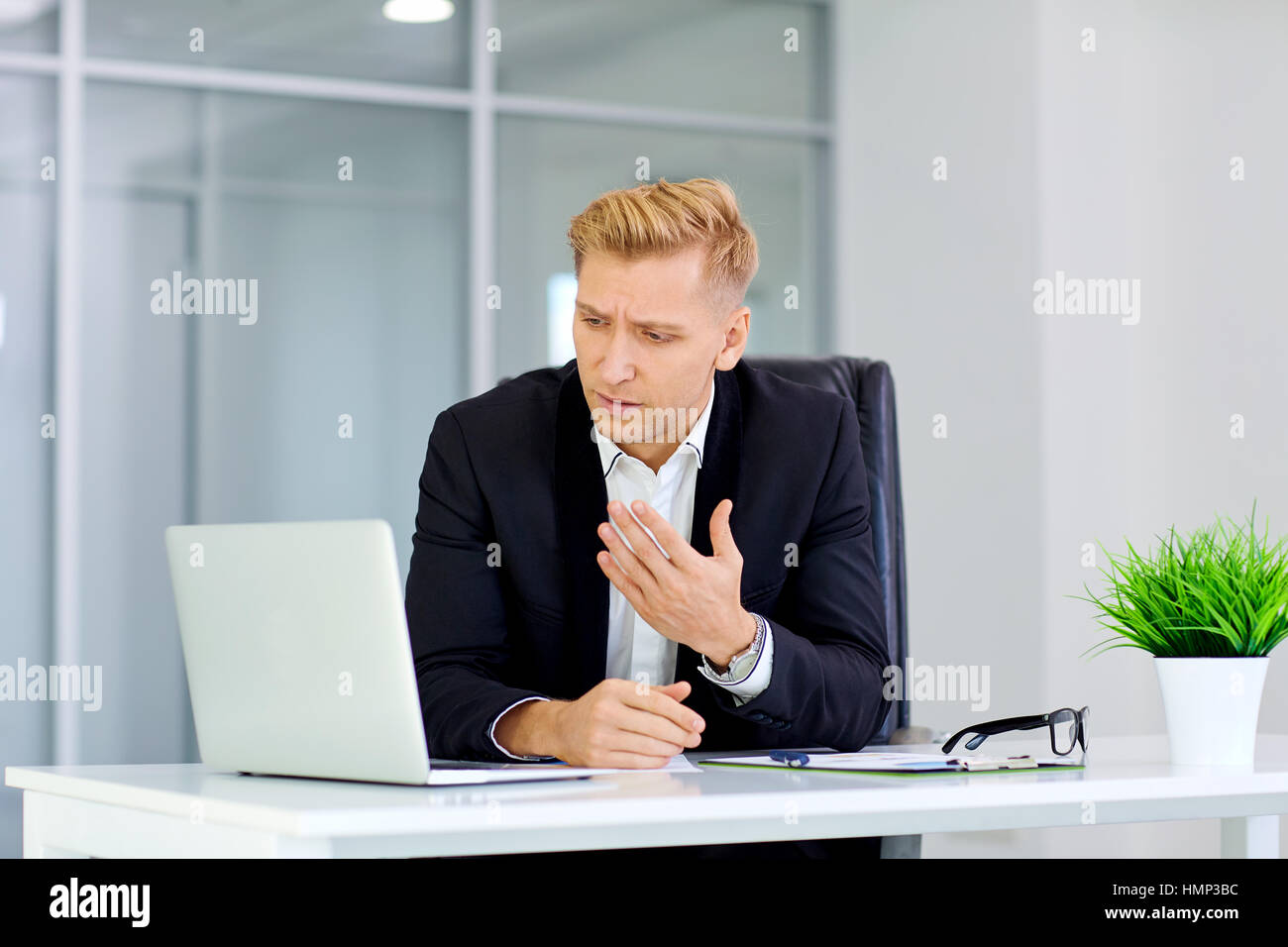 The concept of failure, defeat,  crisis the business. A man sits Stock Photo