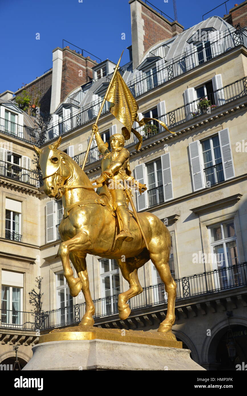 Gilded Bronze equestrian sculpture / statue of french heroine Jeanne d'Arc displayed on Place des Pyramides in Paris by sculptor Emmanuel Frémiet Stock Photo