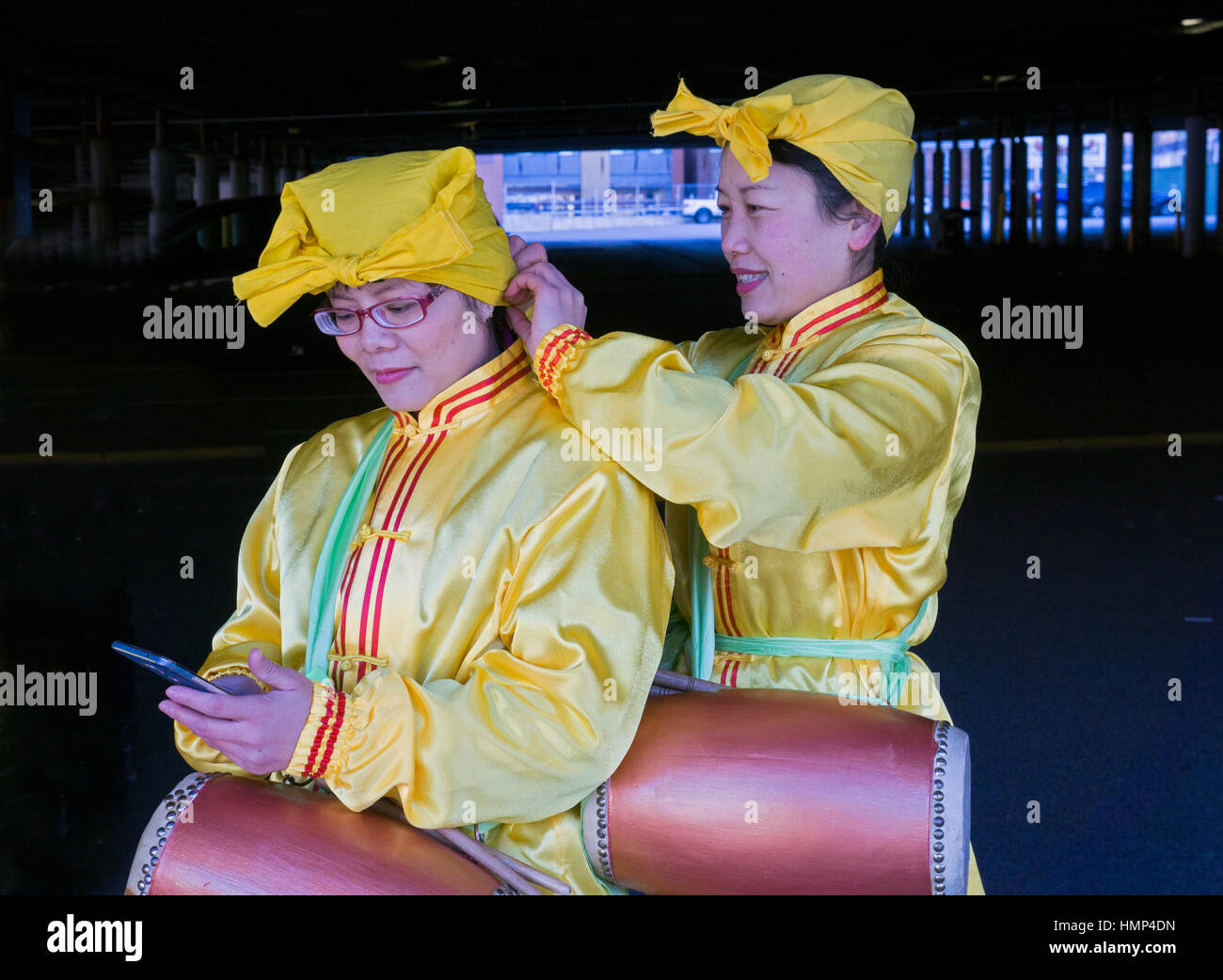 Two beautiful young Falun Gong marchers at the Chinese New Years Day Parade in Chinatown, downtown Flushing, New York City. Stock Photo