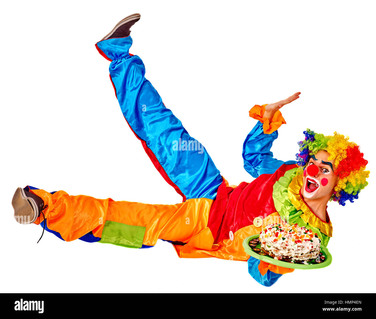 Birthday child clown with cake lying on floor thumb up Stock Photo