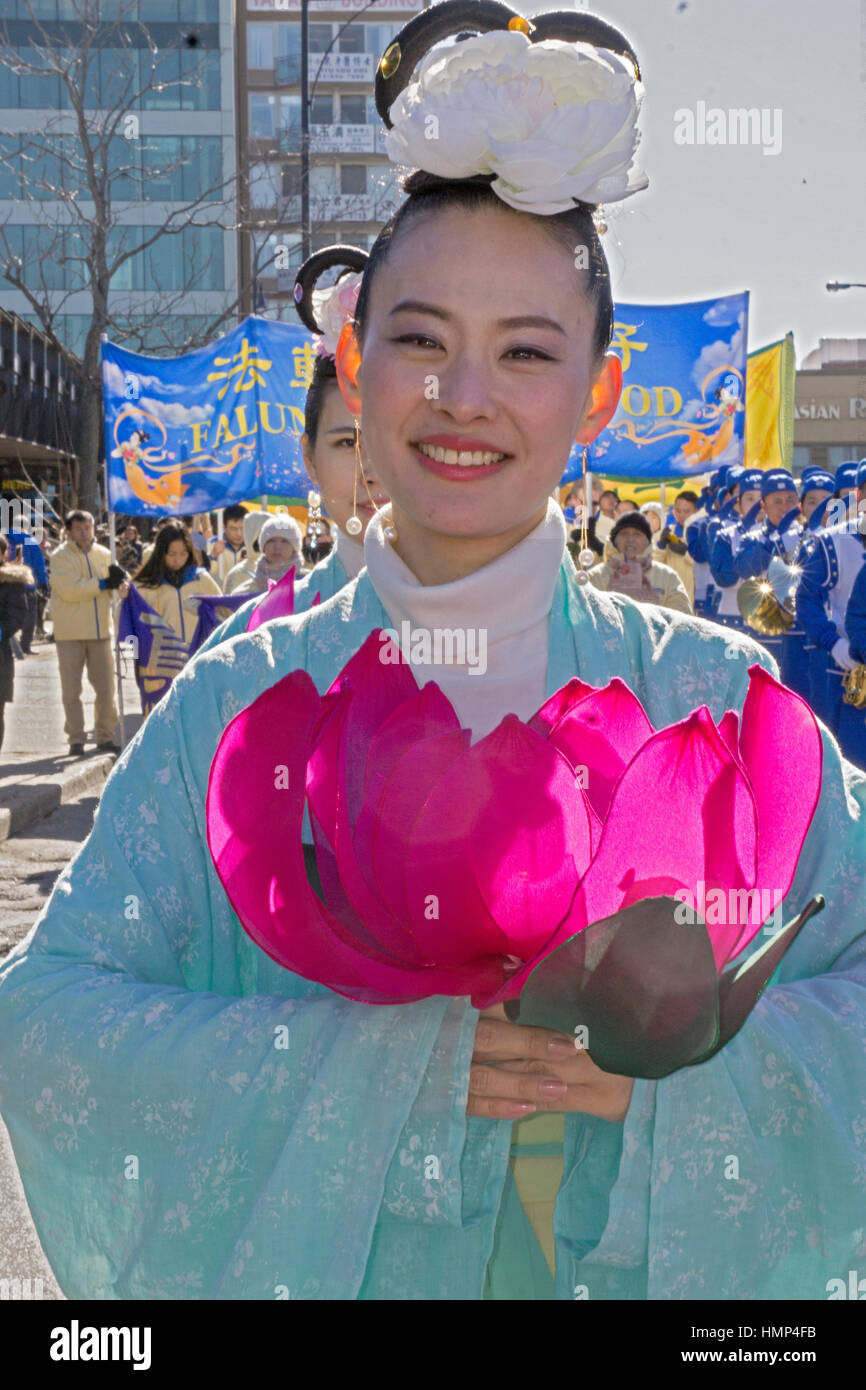 Beautiful women Falun Gong marcher at the Chinese New Years Day Parade in Chinatown, downtown Flushing, New York City. Stock Photo