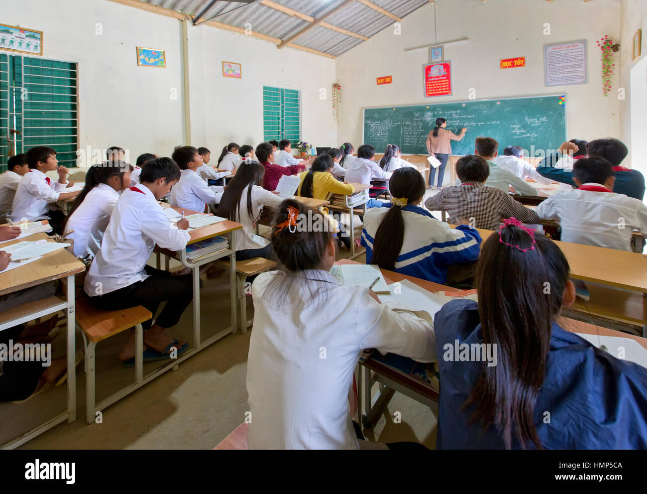 Teacher instructing english class,  students middle school approx. 15 years. of age, boarding school, Na Hoi. Stock Photo