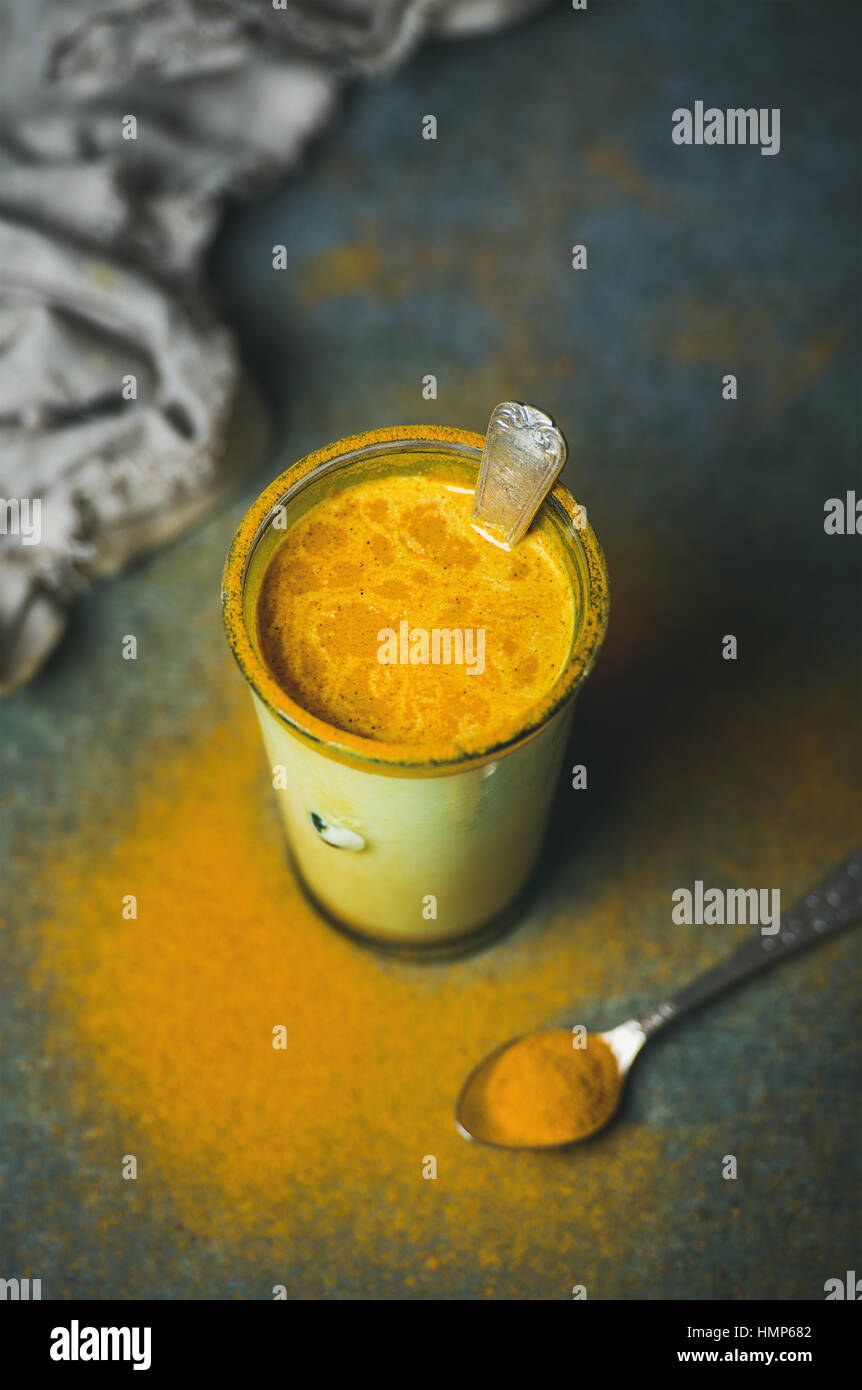 Golden milk with turmeric powder, clean eating detox concept Stock