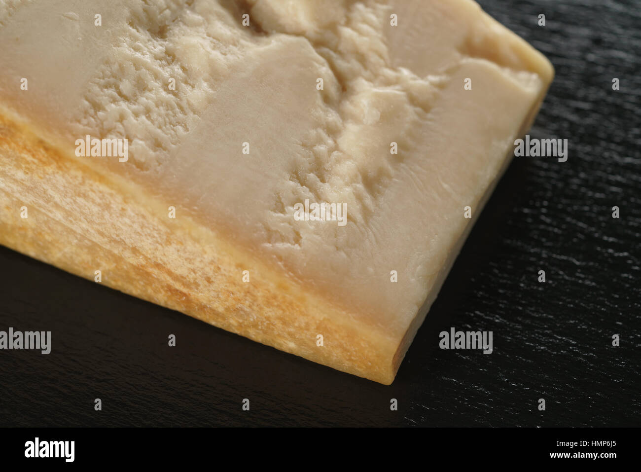 big chunk of italian parmesan cheese on slate board Stock Photo