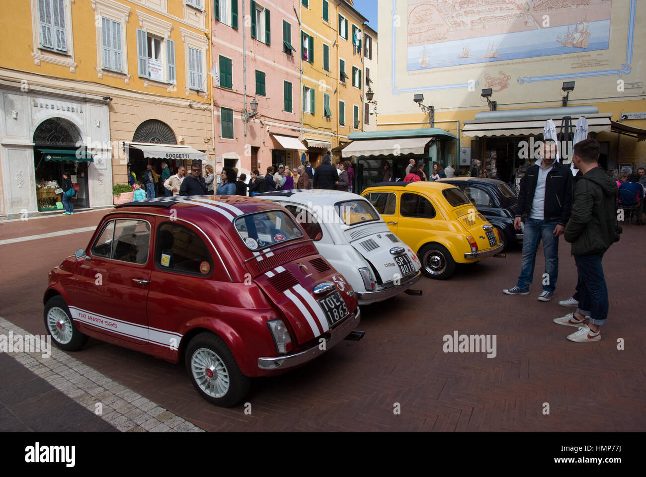 Vintage cars parked in a street in Imperia during the FIAT 500 Classic ...
