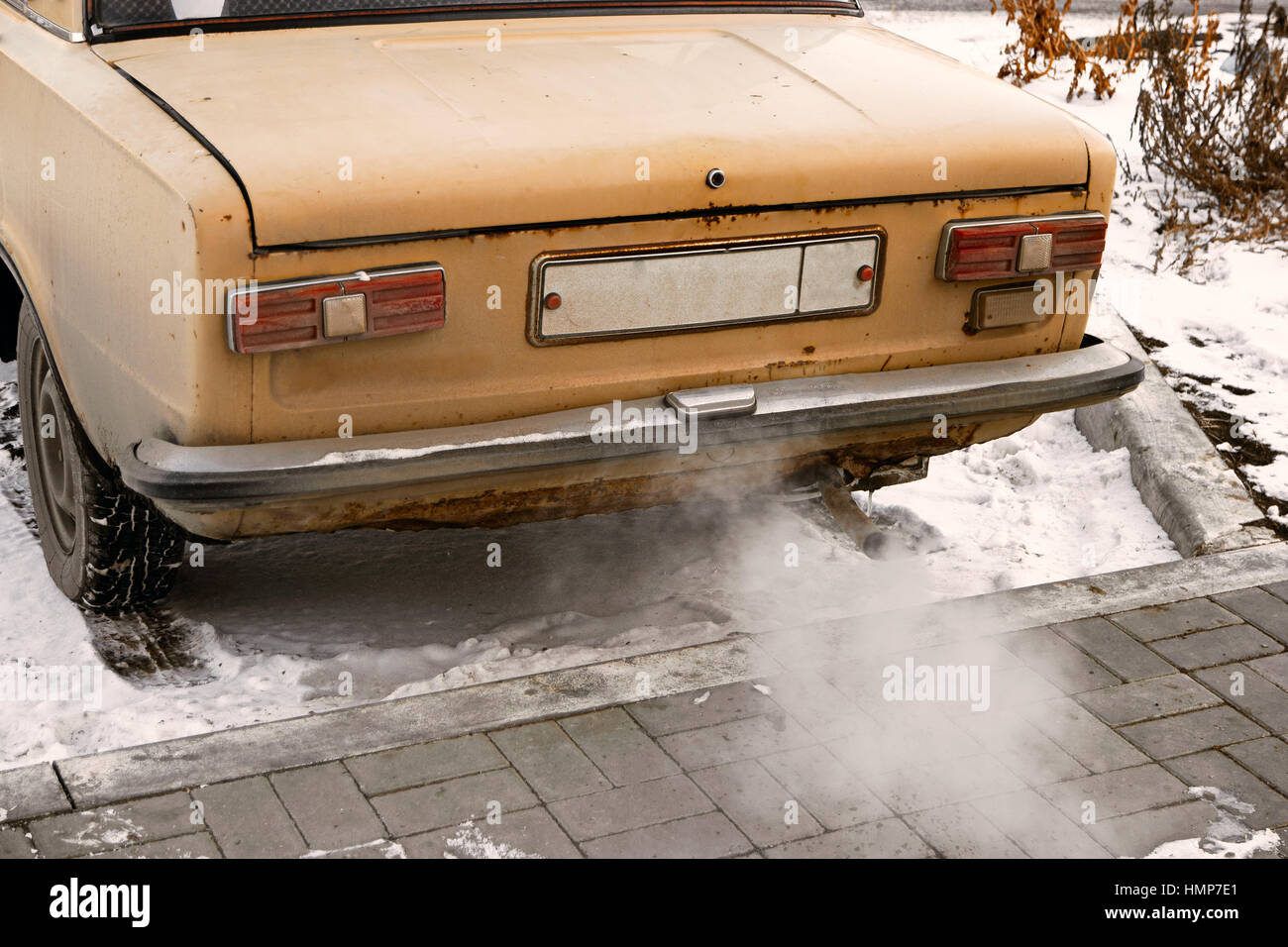 Old car smoking, environmentally dangerous vehicle Stock Photo