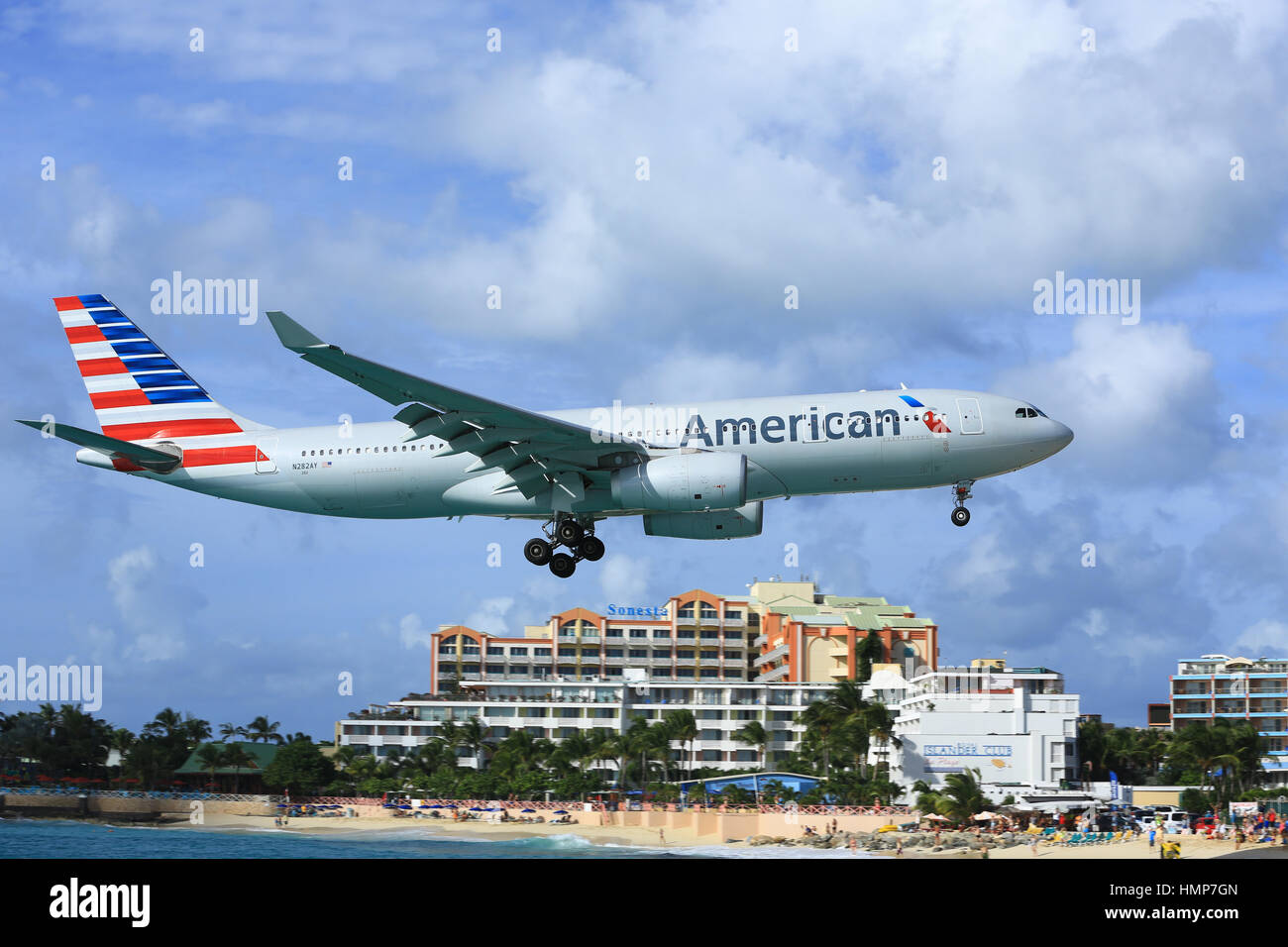 The American Airlines Airbus A.330 on short final approach to land over Maho Beach, Sint Maarten Stock Photo
