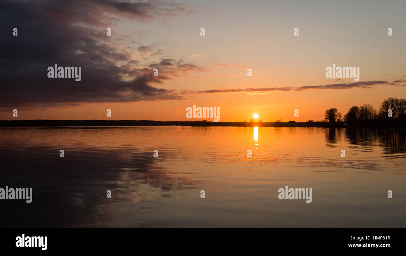 sunset over the sea with dramatic colorful sky Stock Photo - Alamy