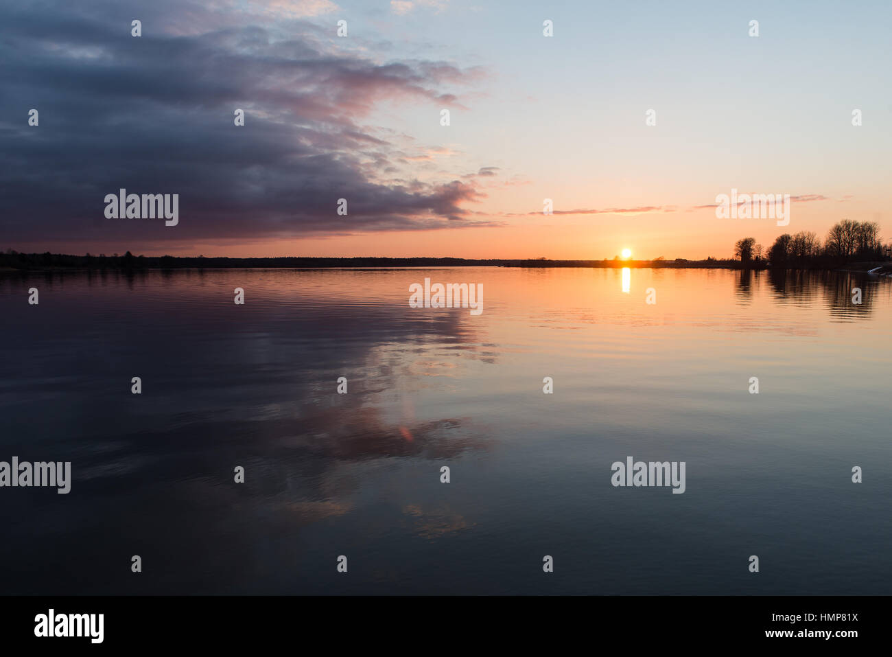sunset over the sea with dramatic colorful sky Stock Photo - Alamy