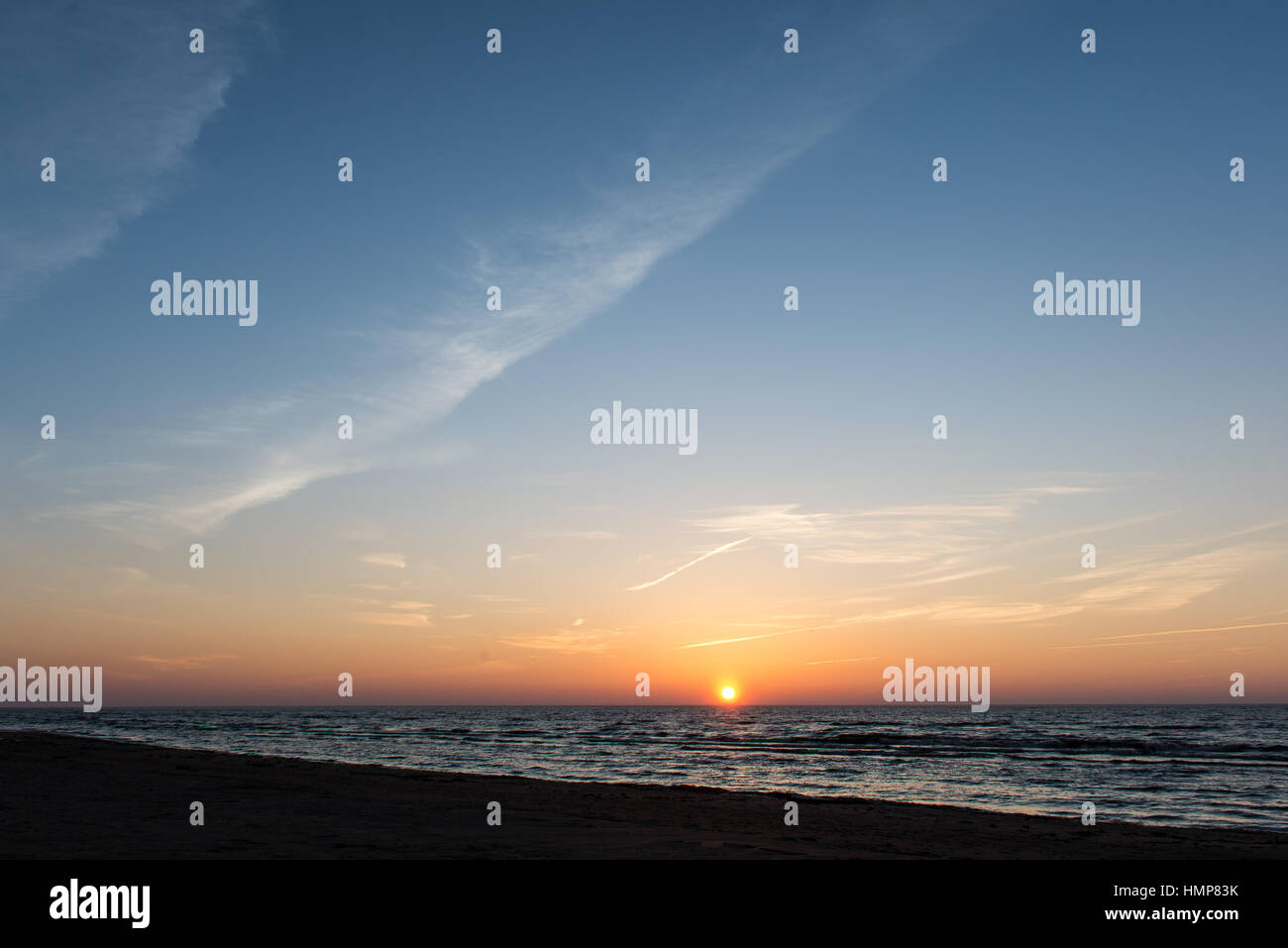 sunset over the sea with dramatic colorful sky Stock Photo - Alamy
