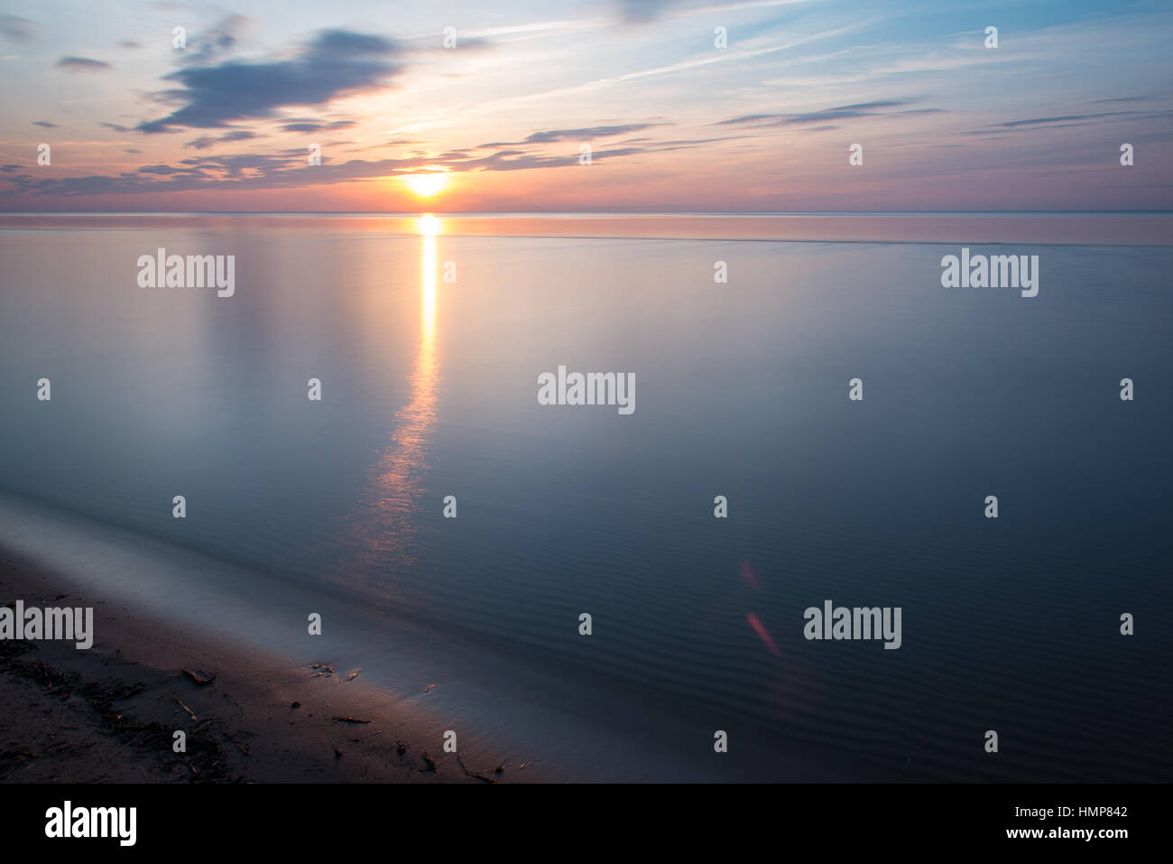 sunset over the sea with dramatic colorful sky Stock Photo - Alamy