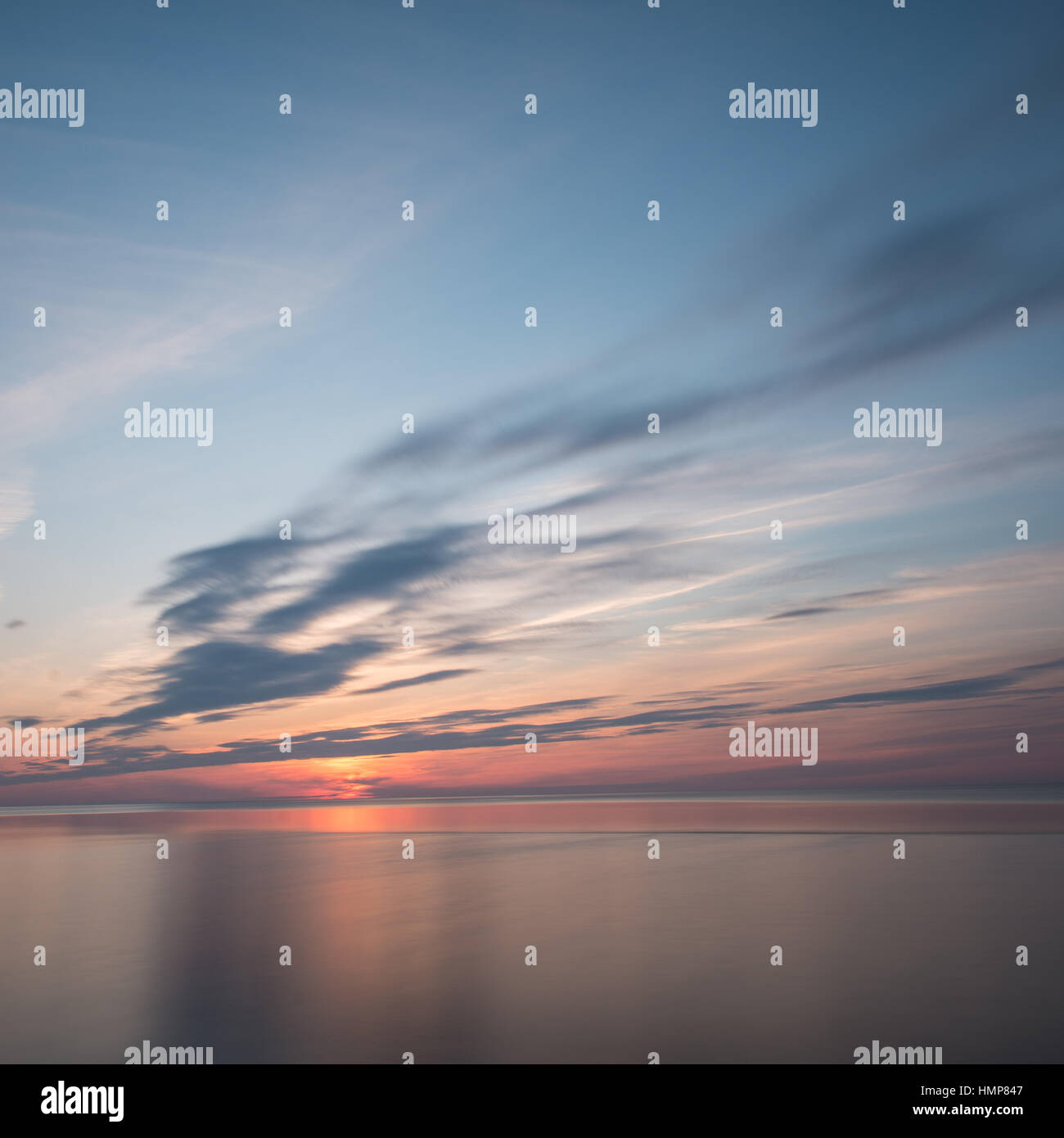 sunset over the sea with dramatic colorful sky Stock Photo - Alamy