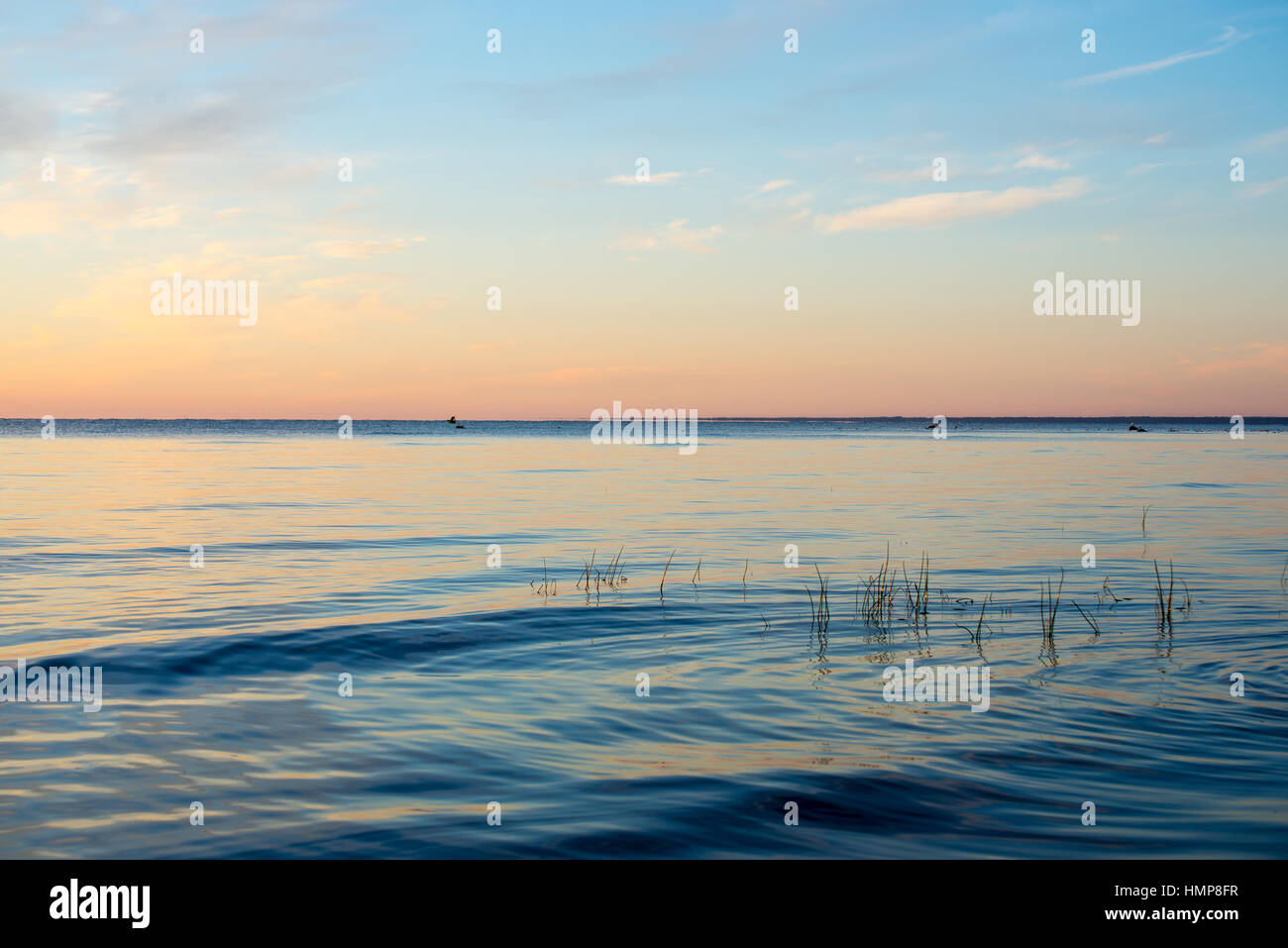 beautiful sunrise in the sea at the wild beach Stock Photo - Alamy