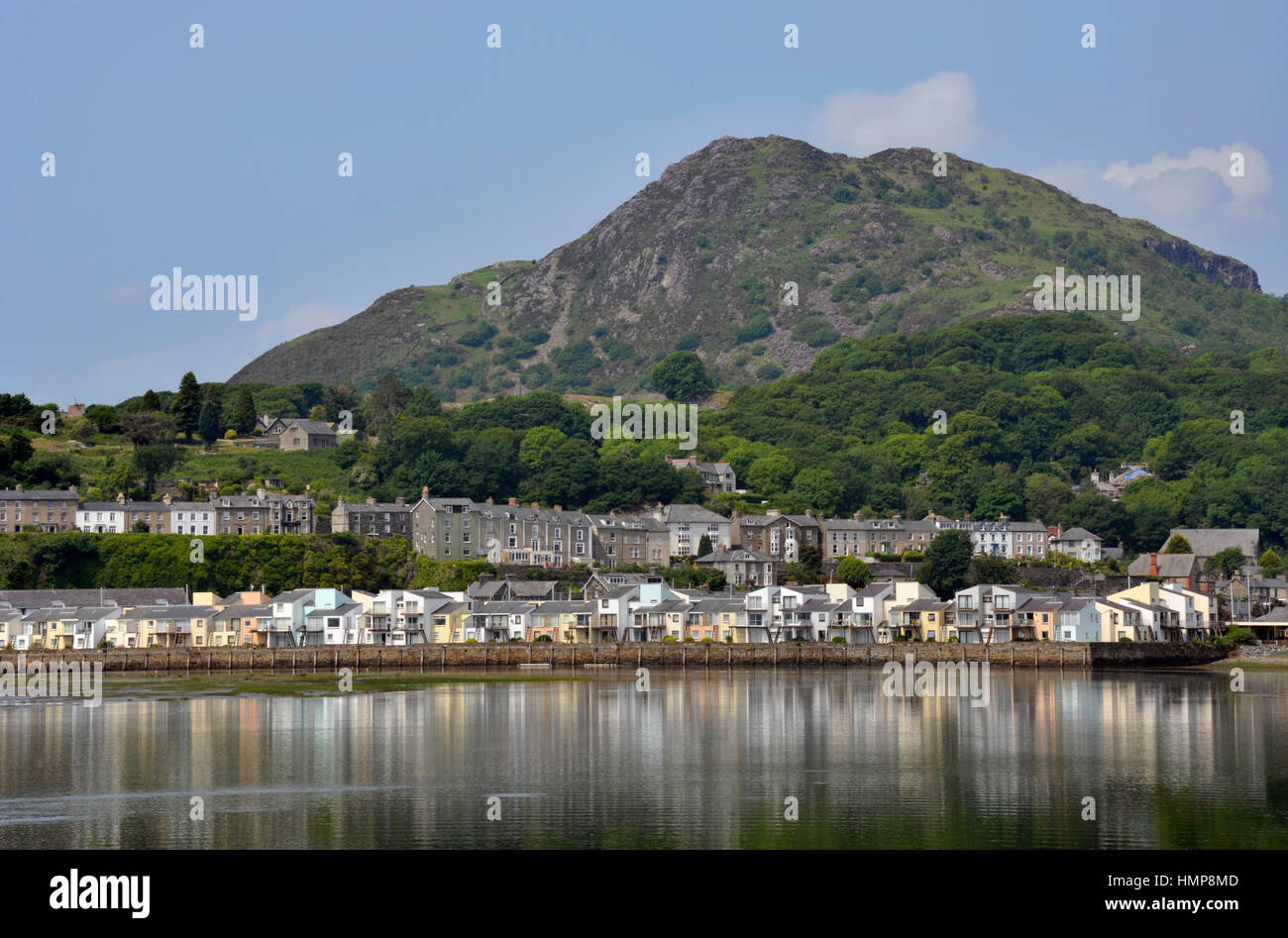 Porthmadog harbour with overlooking houses and the hill Moel-Y-Gest beyond in Wales. UK. Stock Photo