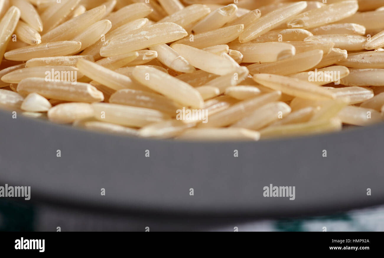 uncooked grains of brown basmati rice Stock Photo Alamy