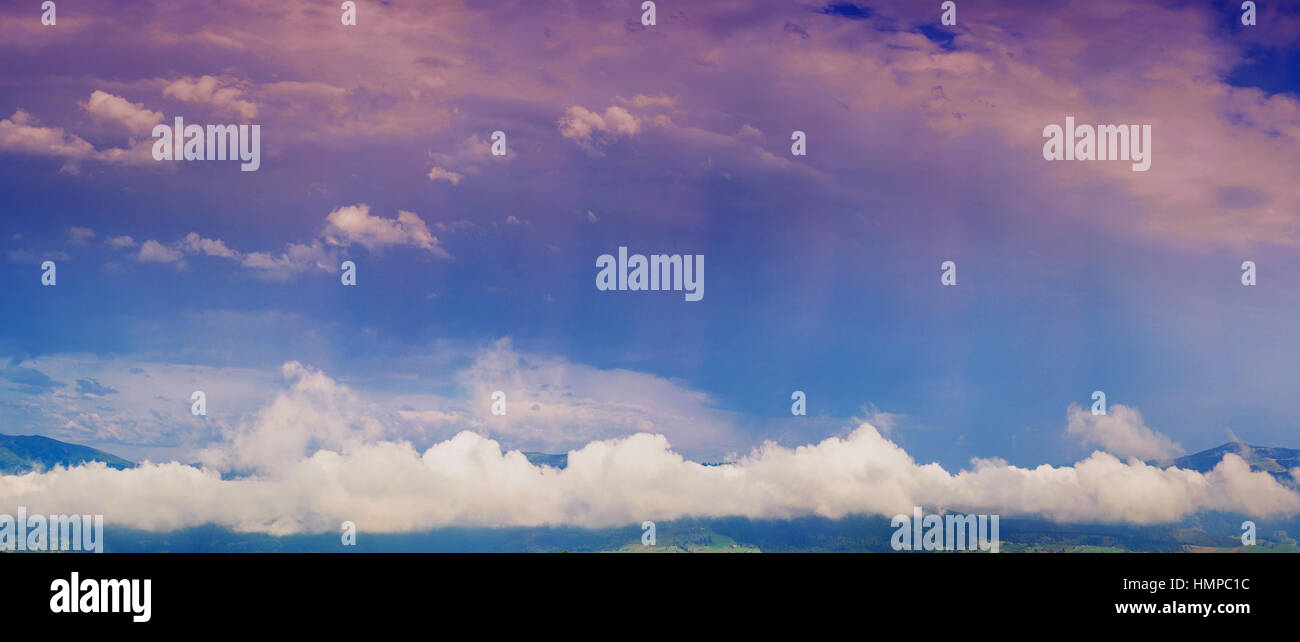 sunset over the mountains Stock Photo - Alamy