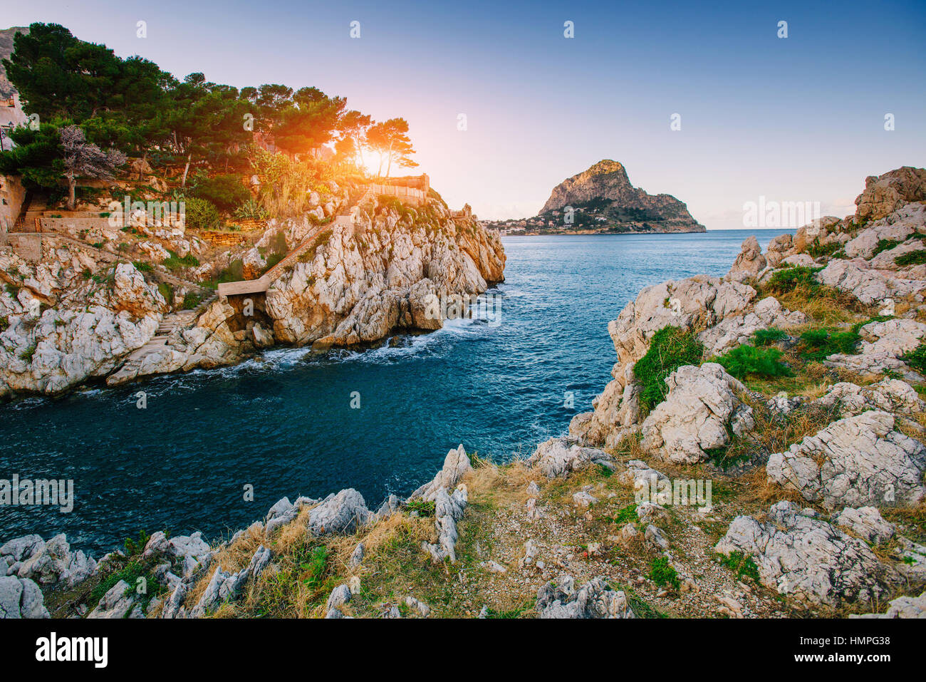 Sunset over the sea with rocks Stock Photo