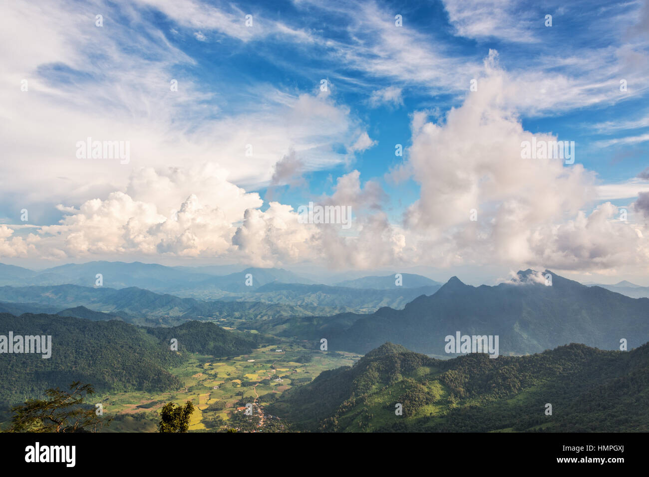 Beautiful landscape blue sky with white cloud above high mountain of the Phi Pan Nam Range from view point on Phu Chi Fa Forest Park in Chiang Rai Stock Photo