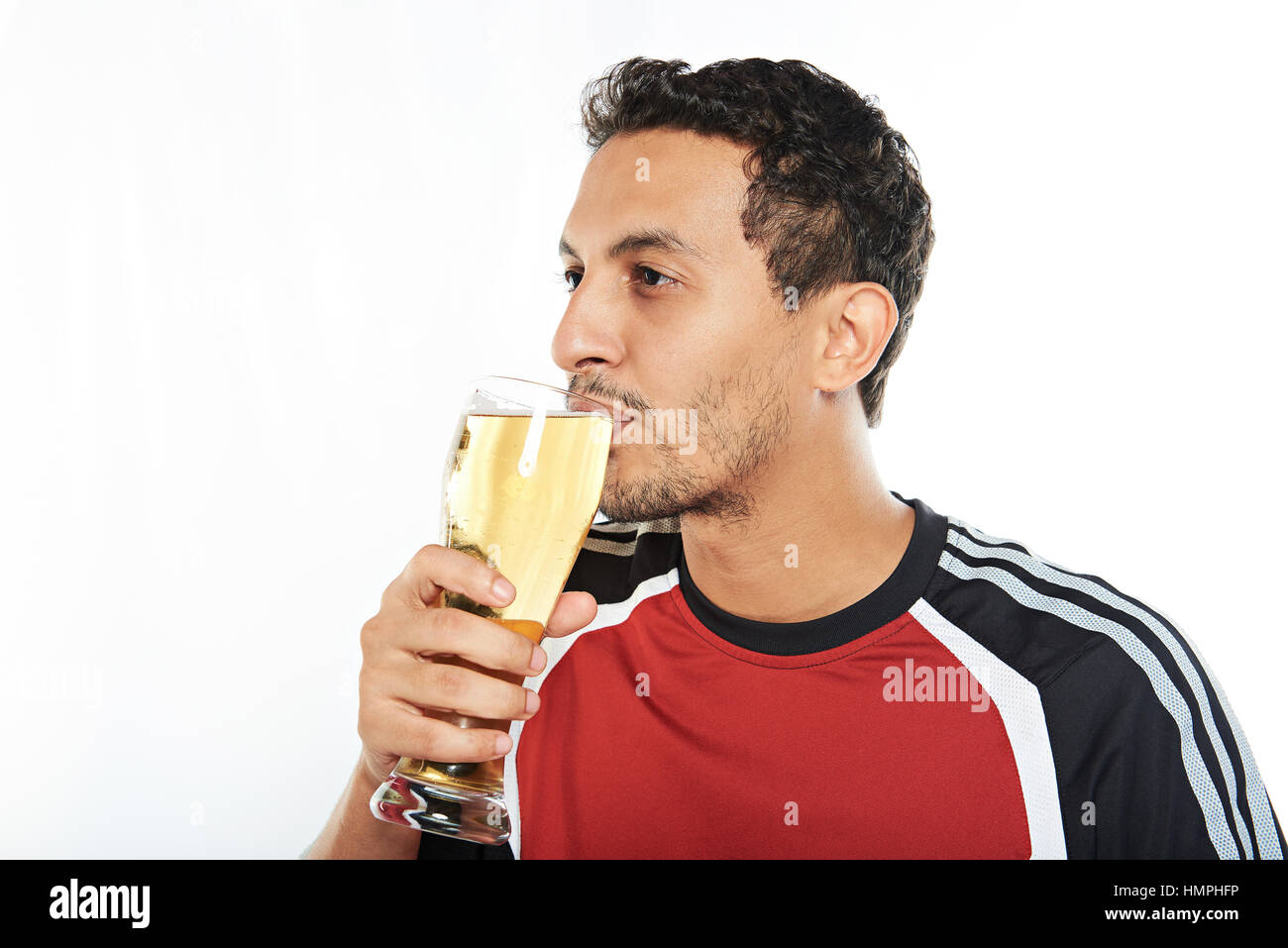 young man drink beer from glass isolated on white Stock Photo Alamy
