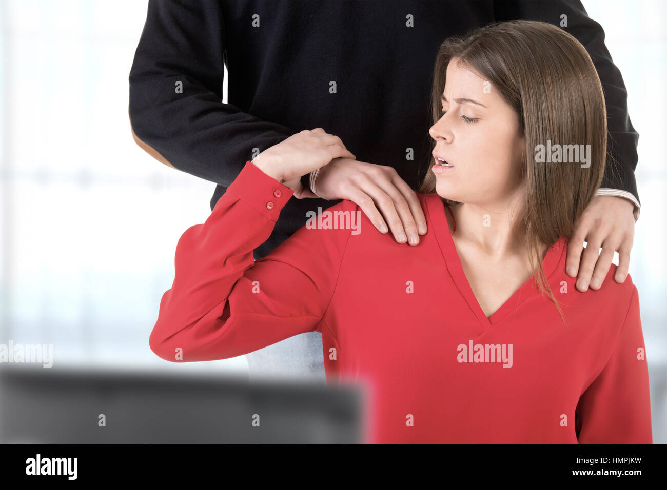 Woman suffering from sexual harassment in the workplace Stock Photo