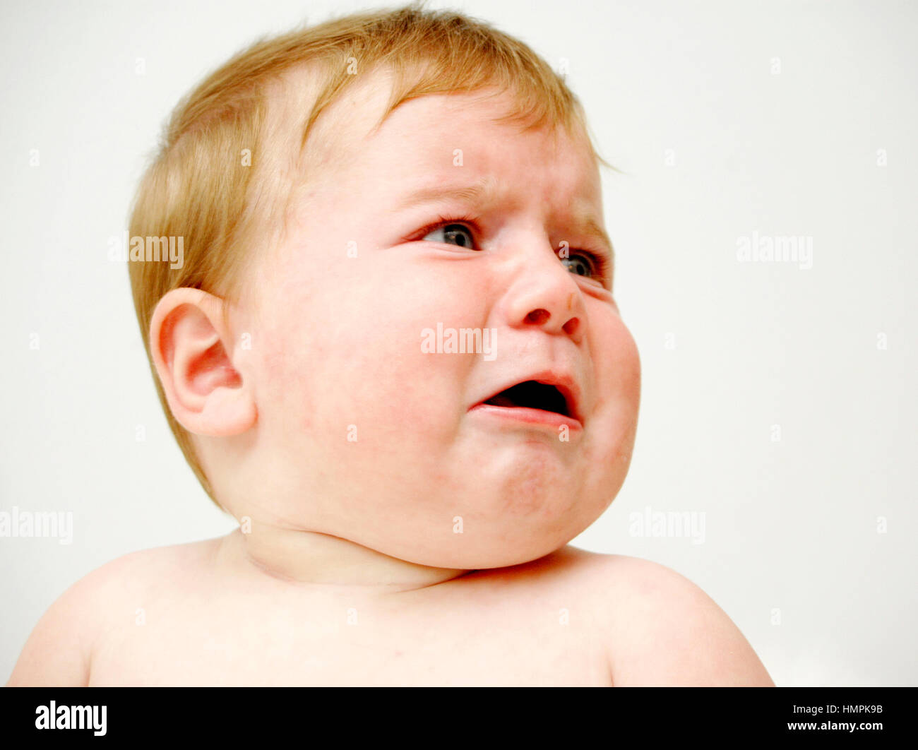 7 month old baby crying Stock Photo