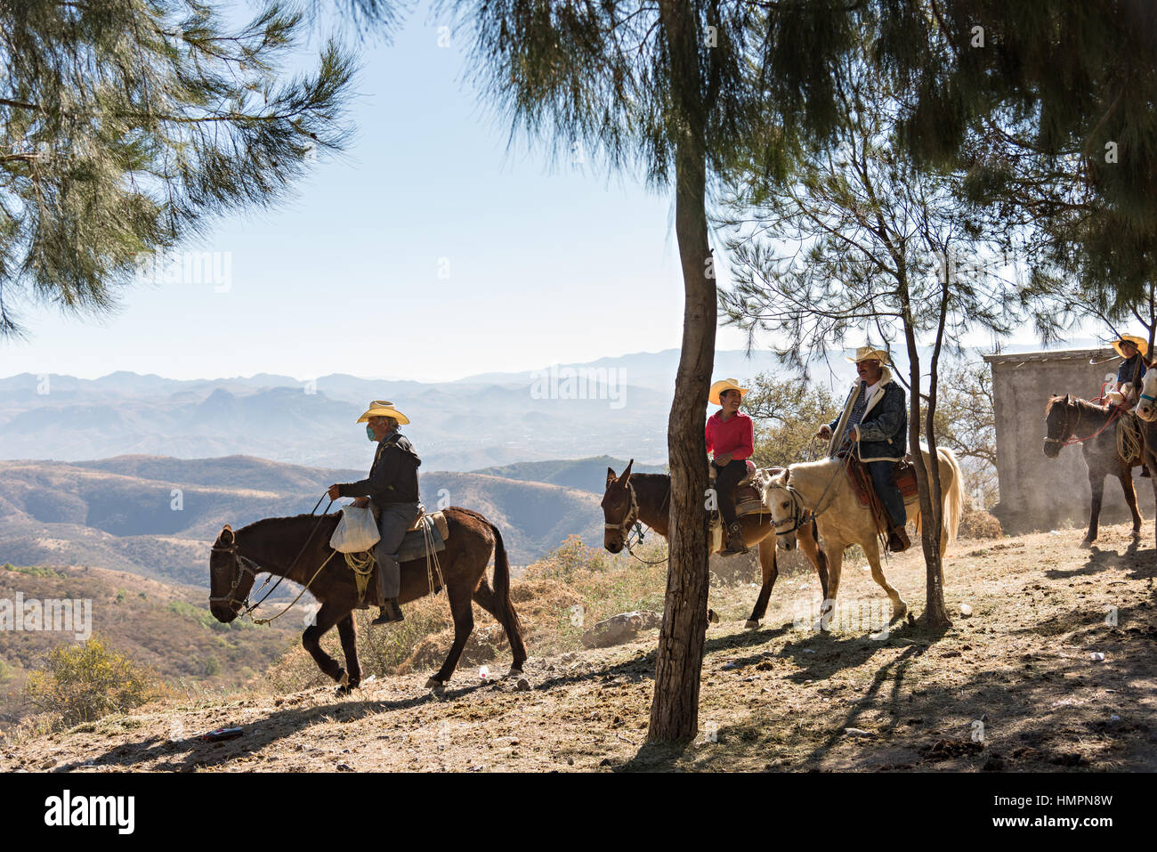 Three cowboys on horseback hi-res stock photography and images - Alamy