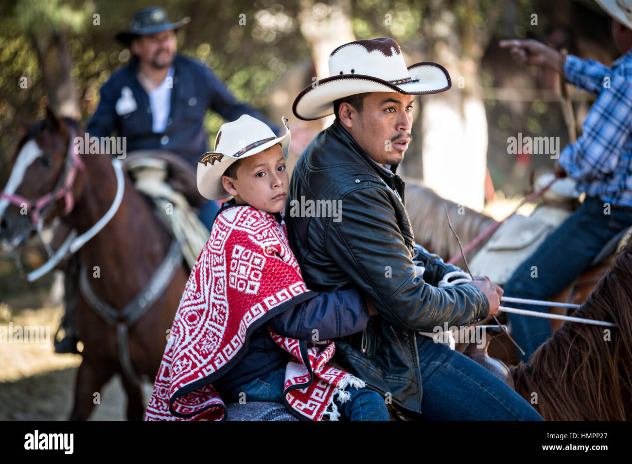 Three cowboys on horseback hi-res stock photography and images - Alamy