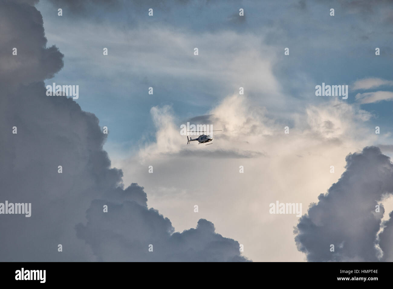October 27, 2016 Medellin, Colombia: a helicopter flies through the clouds inthe second largest city in the county Stock Photo