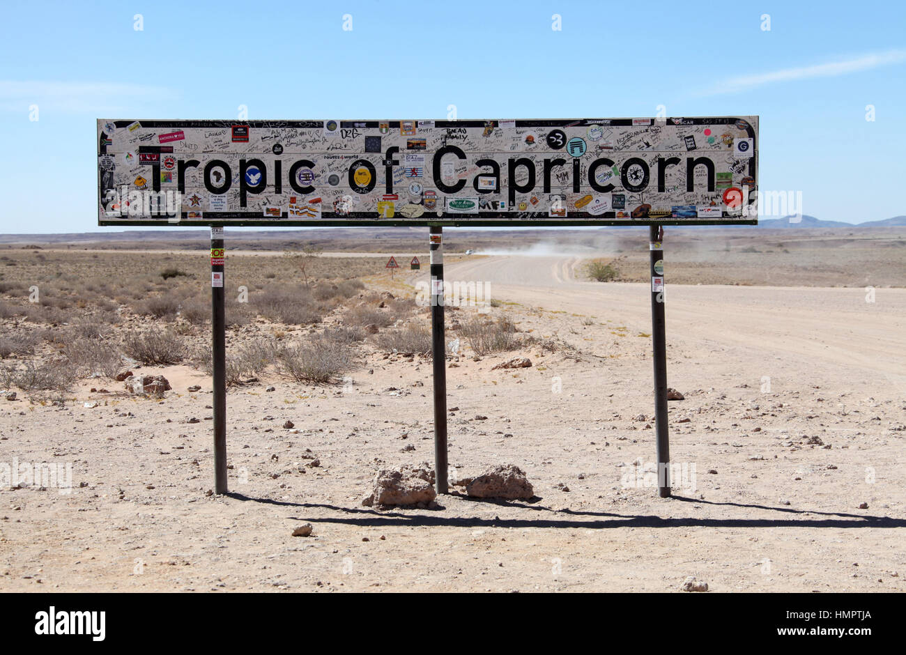 Tropic of Capricorn sign on a gravel road in Namibia Stock Photo