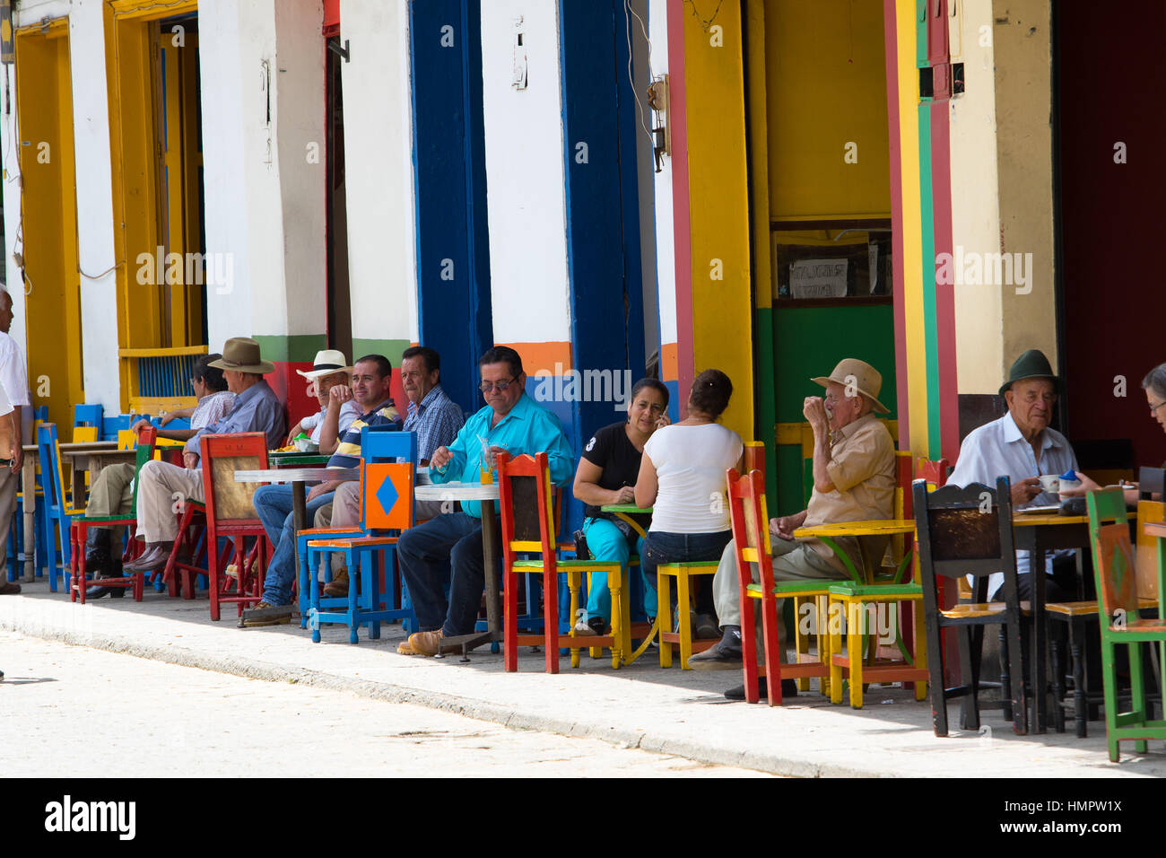 September 30, 2016 El Jardin, Colombia: locals relaxing in the shade in a coffee shop in the center of the tourist town Stock Photo