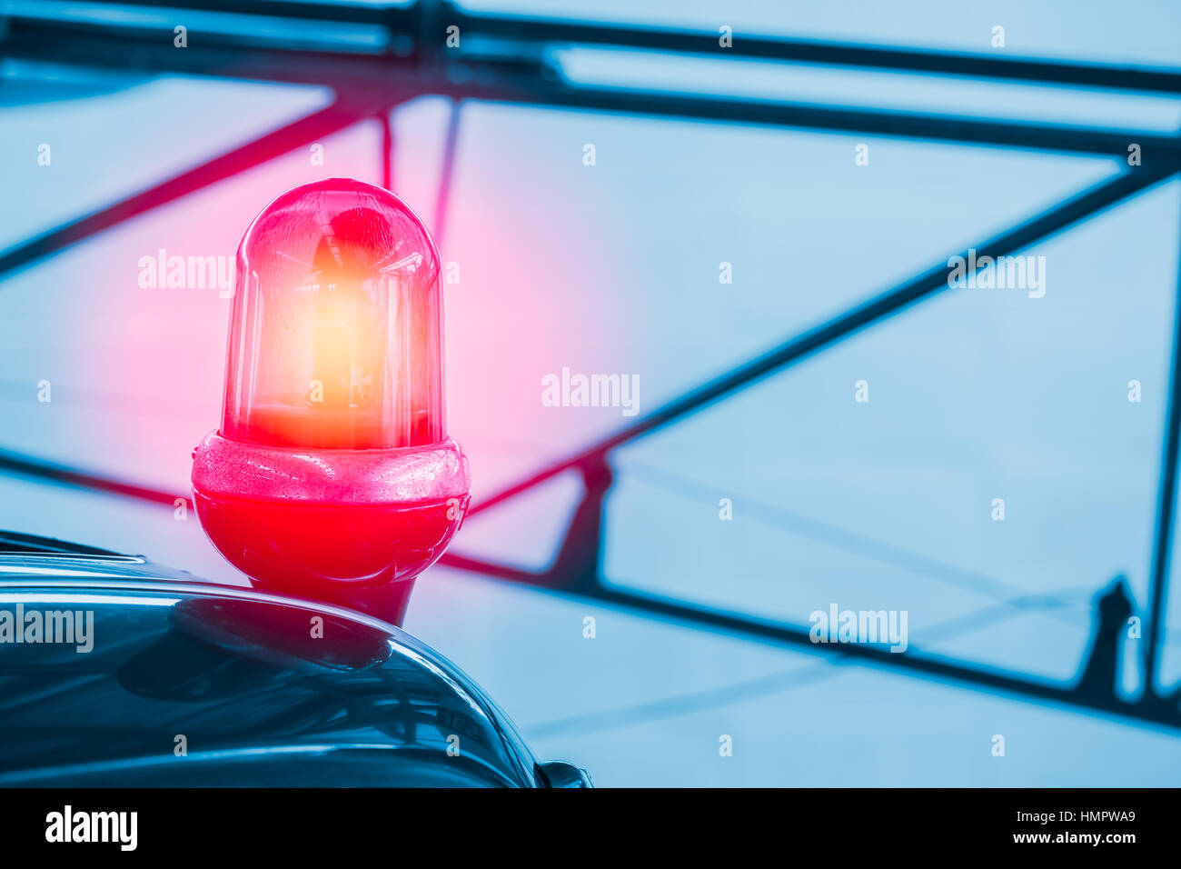 Police vehicle strobe light, Red color lighting flash roll on top of a police car with space for text. Stock Photo