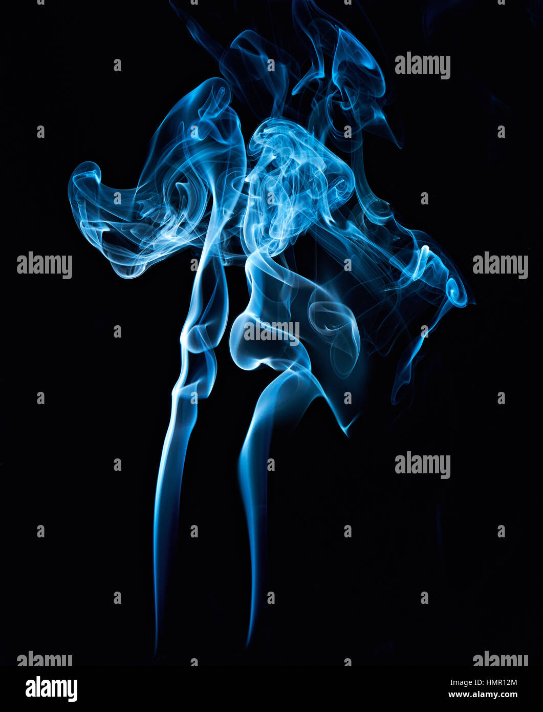 abstract smoke blue swirl isolated on black background Stock Photo - Alamy