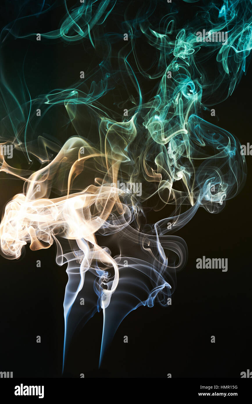 smoke colorful swirls isolated on black background Stock Photo - Alamy